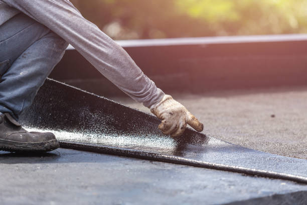 Professional Basement Waterproofing technician working in Norvell, MI